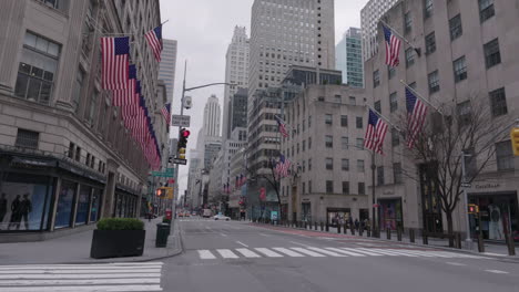 Deserted-5th-avenue-with-American-flags-during-Coronavirus-outbreak