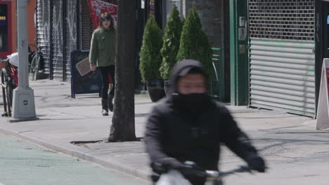 Delivery-Men-and-bicyclist-wearing-face-mask-in-Manhattan
