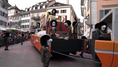 Solothurn,-Switzerland---March-03th,-2019:-A-carnivals-club-wearing-funny-masks-with-huge-noses-playing-walking-the-carnival-deal