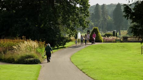 People-Walking-In-The-Trentham-Gardens-On-A-Warm,-Sunny-Saturday