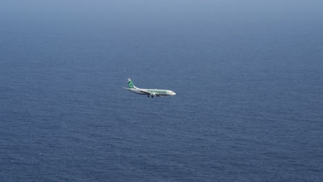 High-Angle-Footage-Of-Plane-Preparing-For-Landing-In-Madeira-Island