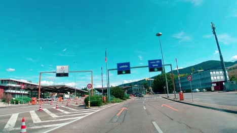 Point-of-view-crossing-border-customs-clearance-drive-through-from-Geneva-Switzerland-to-France---POV