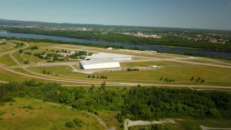 Canada-Aviation-and-Space-Museum,-Ottawa-Rockcliffe-Airport-Canada-capital-skyline-aerial-Sunny-Summer-day