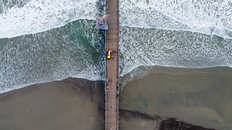 Aerial-drone-shot-of-pier-in-San-Diego,-California