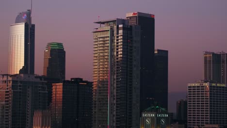 Aerial-view-panning-showing-Skyline-of-Downtown-Los-Angeles-At-Sunset-Twilight