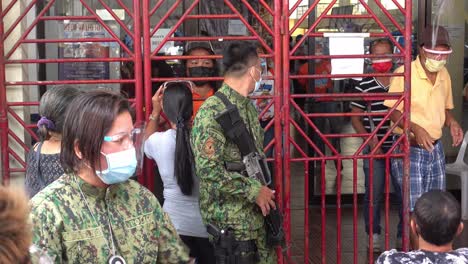 Philippines-Police-are-called-to-keep-control-at-Covid-19-vaccination-stations-while-senior-citizens-queue-for-up-to-12-hours-for-the-chance-to-receive-on-of-the-very-limited-doses-available