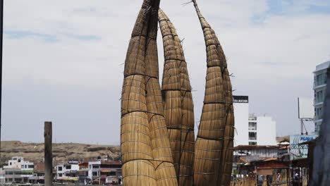 Standing-Inca-Reed-Boats-On-Beach-In-Peru