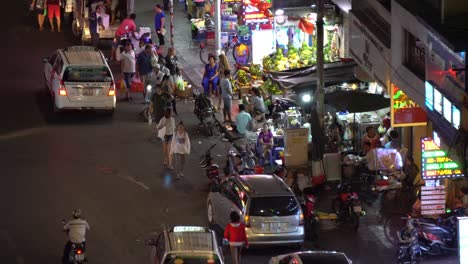 People-on-Street-Night-Market-in-Ho-Chi-Ming,-Vietnam,-An-Authentic-Scenery-From-Southeast-Asia