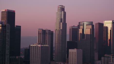 Aerial-View-of-Skyline-Skyscrapers-in-Downtown-Los-Angeles-during-beautiful-colored-sky-after-sunset