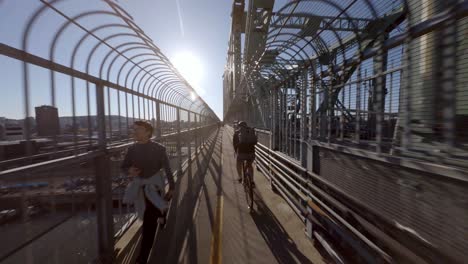 POV-Following-Behind-Bike-Courier-Across-Jacques-Cartier-Bridge-In-Montreal