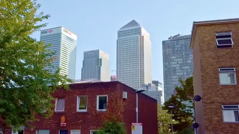 The-contrast-of-economic-inequality,-view-from-government-council-housing-areas-of-East-London-with-One-Canada-Square-Canary-Wharf-at-background