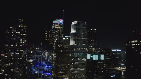 Los-Angeles-CA-USA-at-Night,-Aerial-View-of-Downtown-Skyscrapers-and-Towers-in-Lights