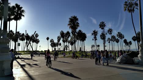 People-entering-and-leaving-Venice-Beach-Boardwalk-during-Covid-19-pandemic-in-Los-Angeles,-California,-USA