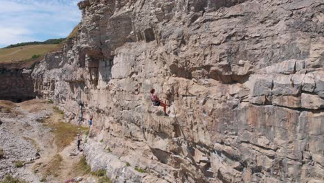 Drone-Shot-of-Strong-Young-Woman-Rock-Climbing-in-the-UK