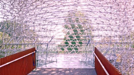 The-entrance-to-The-Hive-art-installation-at-Kew-Gardens-London,-futuristic-structure-design-inspired-by-the-hexagonal-honeycomb