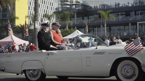 Veterans-wave-to-crowd-from-inside-of-classic-car-during-Veteran's-Day-Parade-2019-in-Downtown-San-Diego