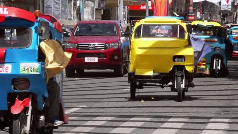Small-tricycle-passenger-cabs-cause-streets-on-overcrowded-streets-of-the-city