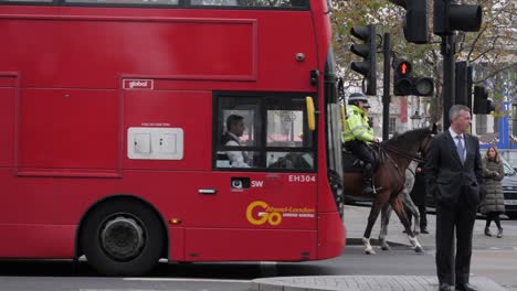 Police-on-horse-in-London-street,-handheld