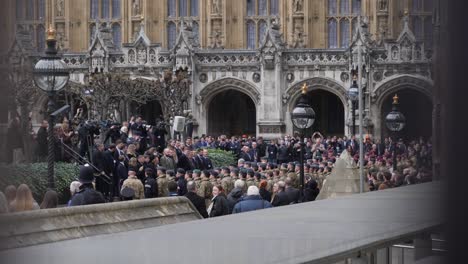 Many-soldiers-in-westminster-yard-through-metal-fence