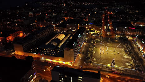 Aerial-view-around-the-Rewell-shopping-center,-winter-night-in-Vaasa,-Finland
