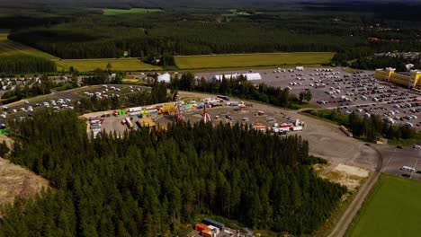 Aerial-view-around-the-Miljoona-tivoli,-summer-in-Tuuri,-Finland---circling,-drone-shot