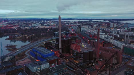 Aerial-view-overlooking-the-Ruoholahti-district-in-cloudy-Helsinki,-Finland---tracking,-drone-shot