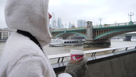 Woman-London-queen-walk-with-plastic-cup