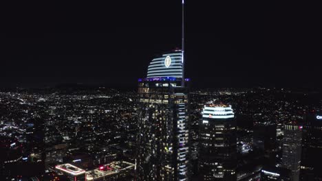 Aerial-View-of-Wilshire-Grand-Center-Tower-in-Downtown-Los-Angeles-CA-at-Night