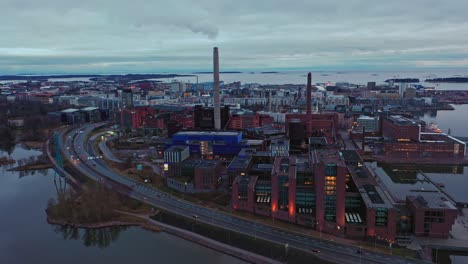 Aerial-view-over-the-Ruoholahti-industrial-area-of-gloomy-Helsinki,-Finland---circling,-drone-shot