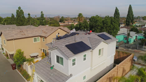 Technicians-Installing-Solar-Panels-On-House-Roof-In-Los-Angeles,-California