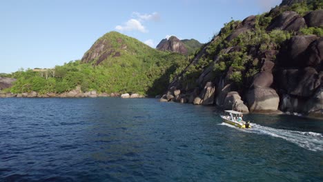 Drone-Tracking-Passenger-Speed-Boat-from-Anse-Major-to-Beau-Vallon-on-Mahe-Island,-Seychelles