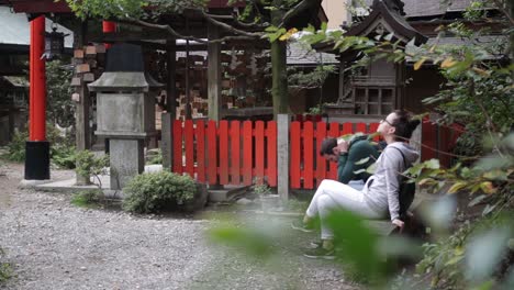Tourists-relaxing-at-the-temple-in-Kyoto---Shinto-Shrine