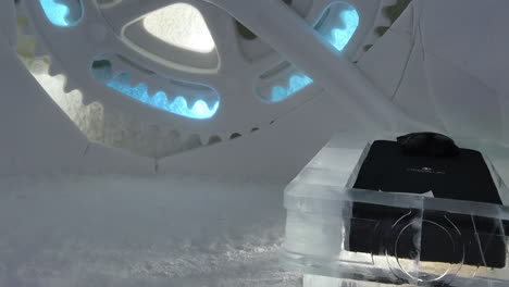 Frozen-Snow-Ice-Carving-of-Engine-Cog-Wheel-Mechanical-Part,-Snow-Village,-Lapland-Hotel