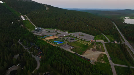 Aerial-view-overlooking-the-Levi-activity-park,-summer-in-north-Finland---tracking,-drone-shot