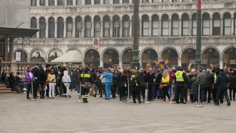 Security-guarding-the-closed-down-part-of-St-Mark's-Square-on-the-last-day-of-Venice-Carnival