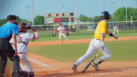 Slow-Motion-Shot-Of-Baseball-Player-Swinging-His-Bat-And-Hitting-The-Ball-During-A-Game,-Florida,-USA