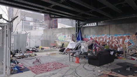 Homeless-men-rag-house-under-elevated-subway-platform-in-NYC