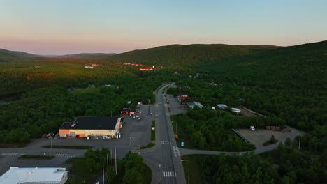Aerial-view-over-the-Utsjoki-town-,-during-midnight-sun-in-Lapland,-Finland