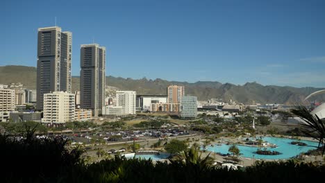 Panoramic-view-of-Santa-Cruz-de-Tenerife,-Tall-buildings,-Water-Park-and-traffic