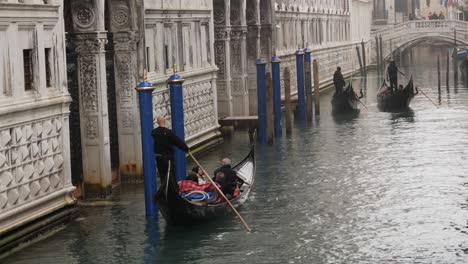 Gondolas-on-the-misty-canal-in-Venice-after-the-cancelled-Carnival