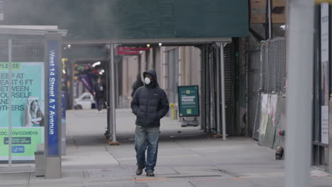 Men-with-face-mask-walking-in-slow-motion-with-smoke-filling-up-the-frame