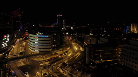 Aerial-view-of-Kanslerinrinne-and-the-Kansikatu-street,-night-in-downtown-Tampere,-Finland