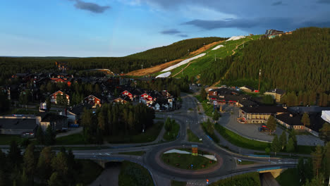 Aerial-view-overlooking-the-Levi-village,-summer-evening-in-Lapland,-Finland---tracking,-drone-shot