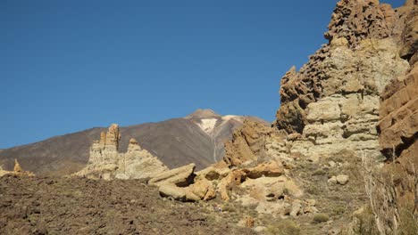 Big-rock-formation-in-the-canyon-of-Teide-National-Park,-Teide-volcano-in-background