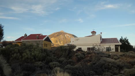 View-of-Mount-Teide-between-two-houses-in-Teide-National-Park