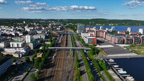 Aerial-view-in-front-of-the-railway-station-of-Jyvaskyla,-Finland---descending,-drone-shot