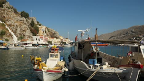 Smaller-and-bigger-boats-tied-together-in-the-colorful-harbor-of-Symi-Island