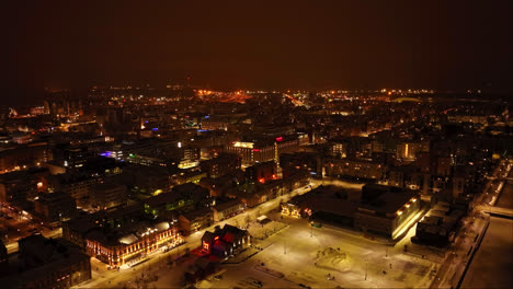 Aerial-view-of-the-market-hall-and-city-center,-winter-night-in-Oulu,-Finland