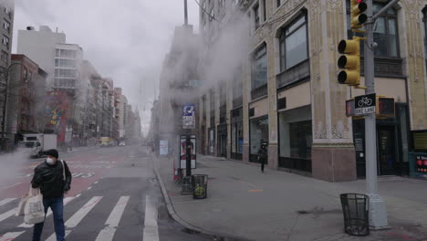 Man-walking-with-face-mask-in-slow-motion-shot-with-steam-across-the-frame
