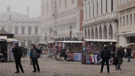 Street-Vendors-In-The-Harbor-In-Venice-Near-St-Mark's-Square-After-The-Cancelled-Carnival-In-A-Foggy-Morning
